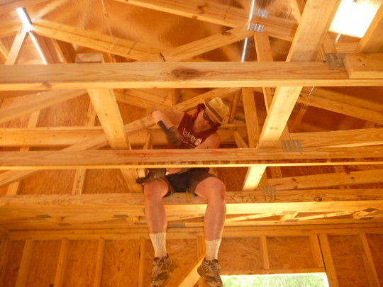 volunteer working on the inside of the house