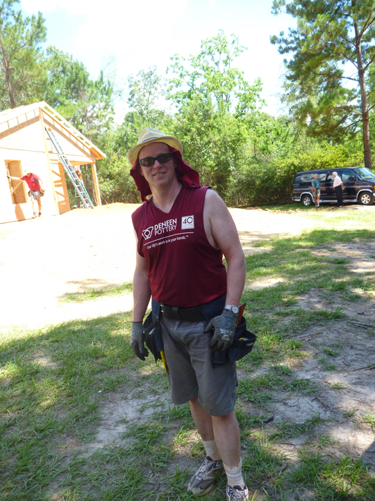 Photo of Volunteer with Deneen Pottery shirt 