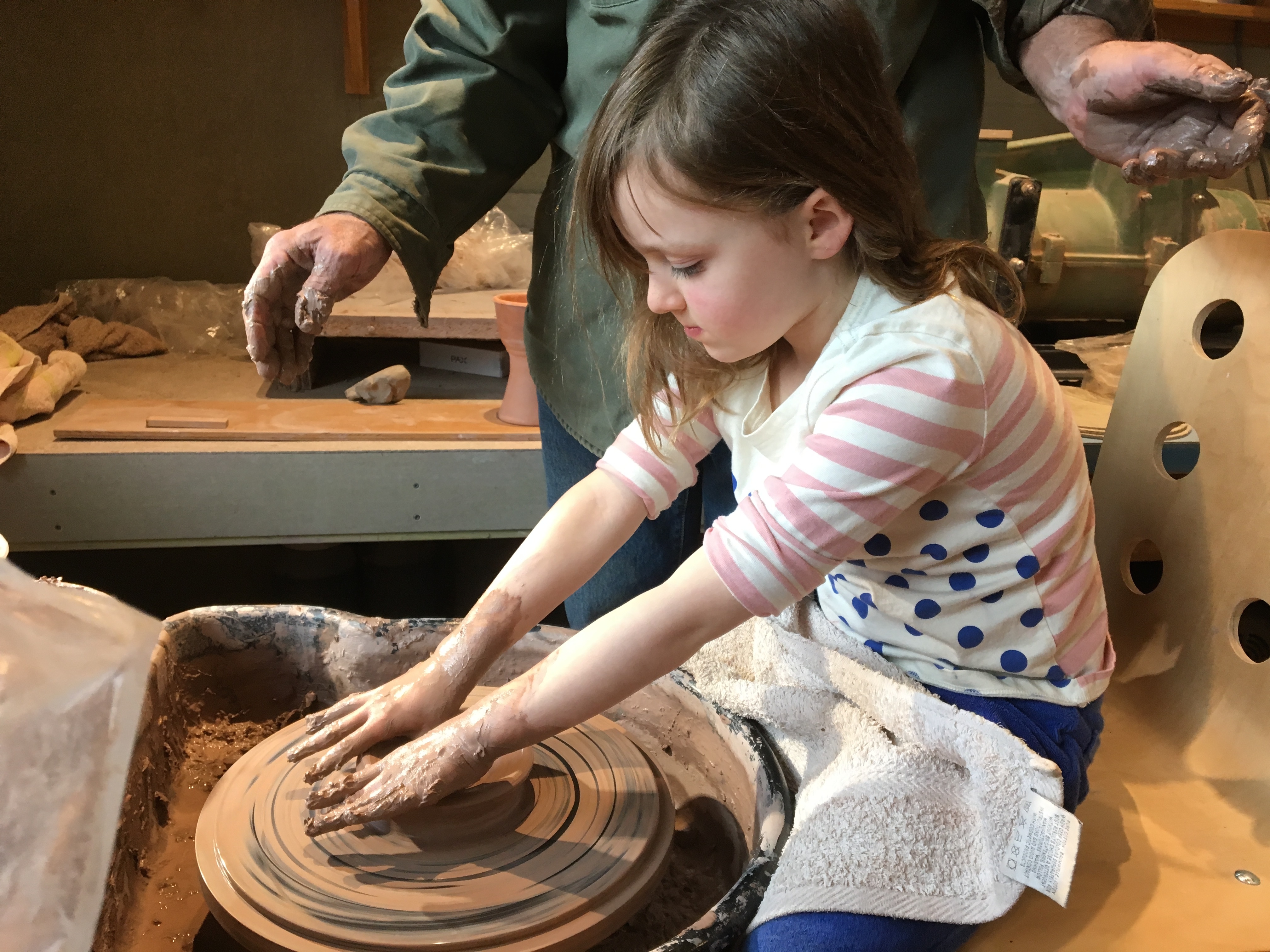 Eloise working on the potter's wheel 