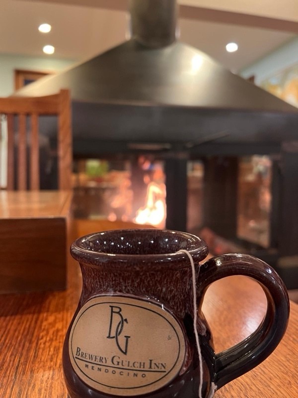 mug by a fire place